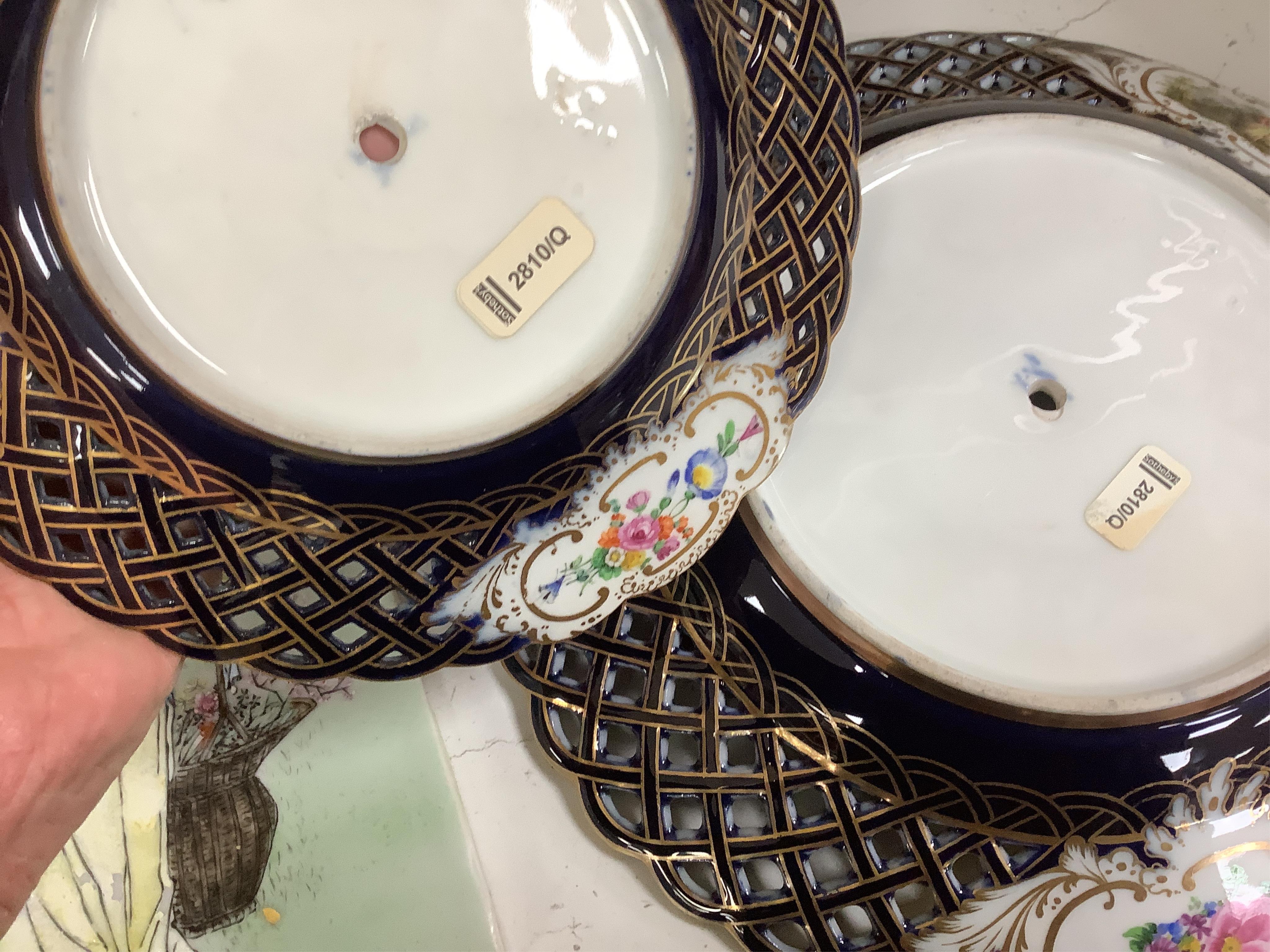 A pair of late 19th century Meissen three tier cake stands with figural tops, 48cm high